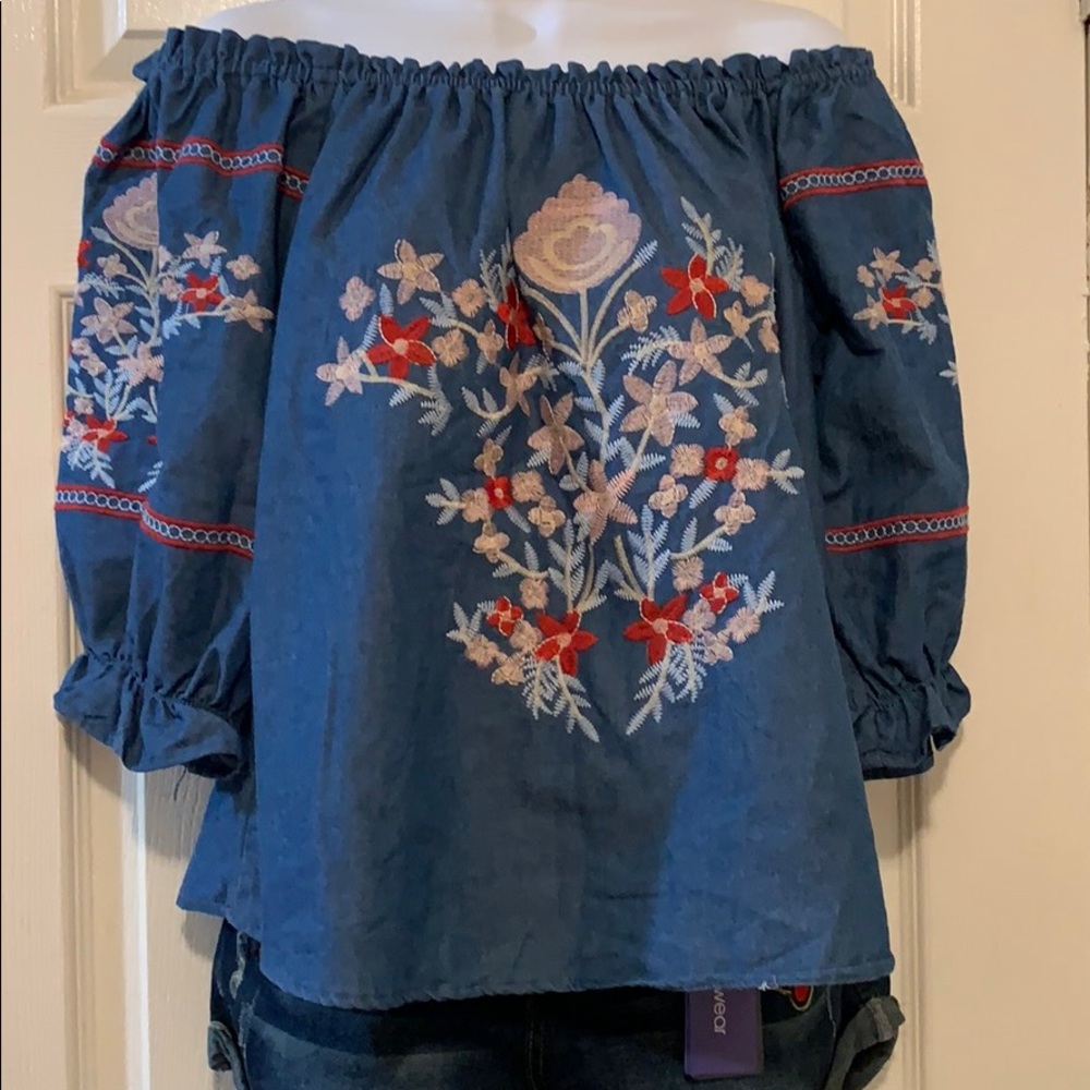 Women denim embroidered blouse.